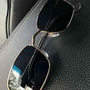 Black square sunglasses with gold frame